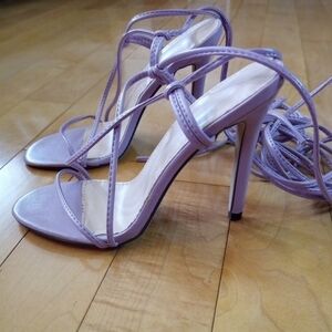 Lavender strappy stiletto heels that wrap around the leg
